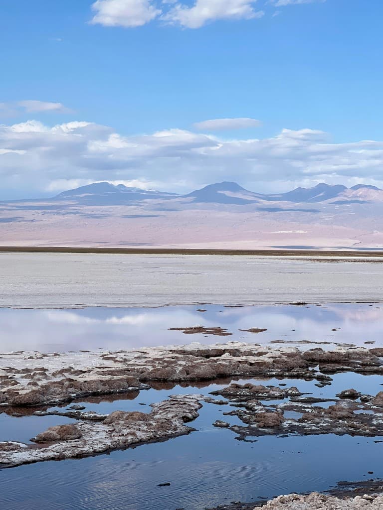 Reflective salt pools and white salt flats of the Atacama Desert