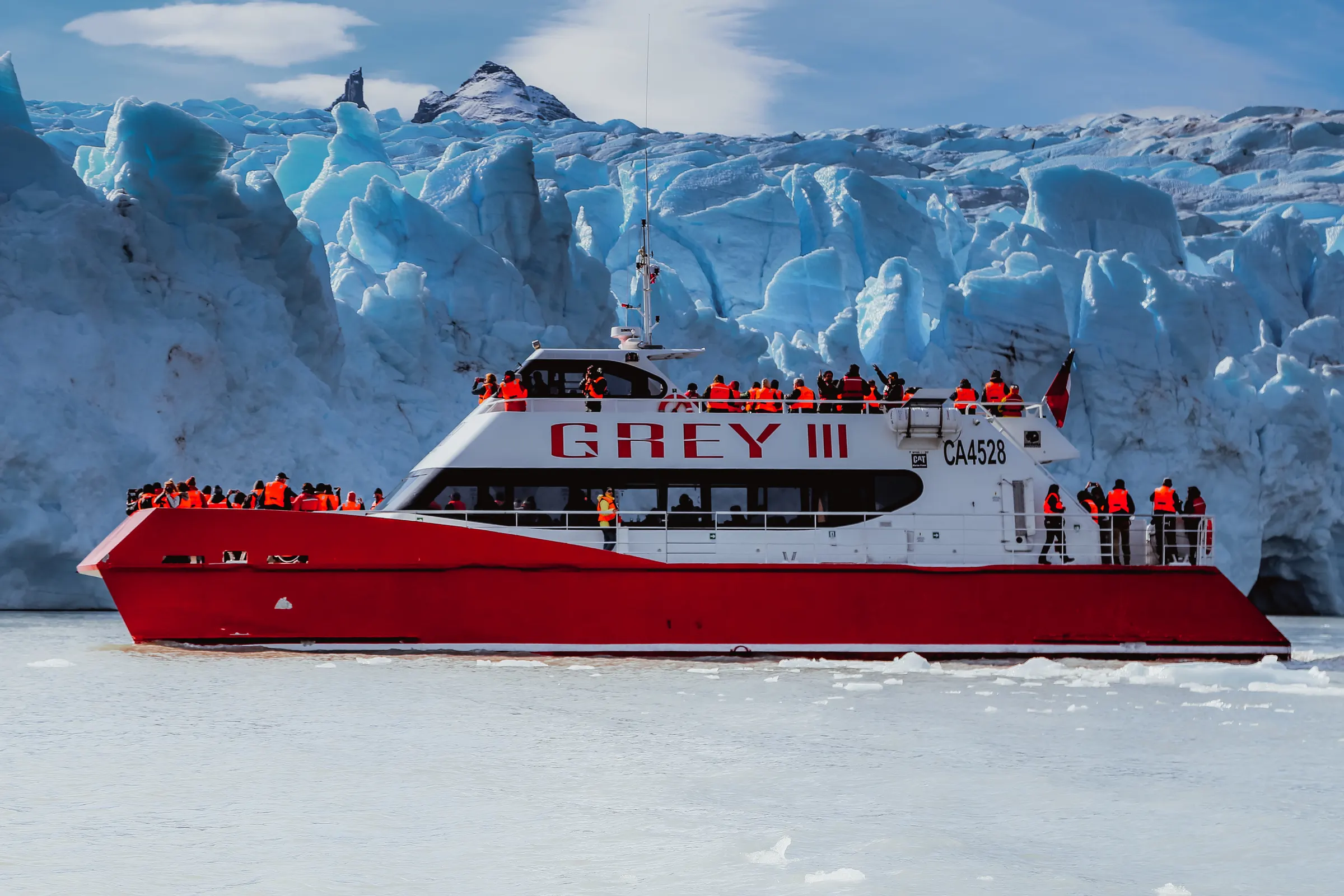 The Grey III catamaran in front of the ice wall of Grey Glacier, Torres del Paine