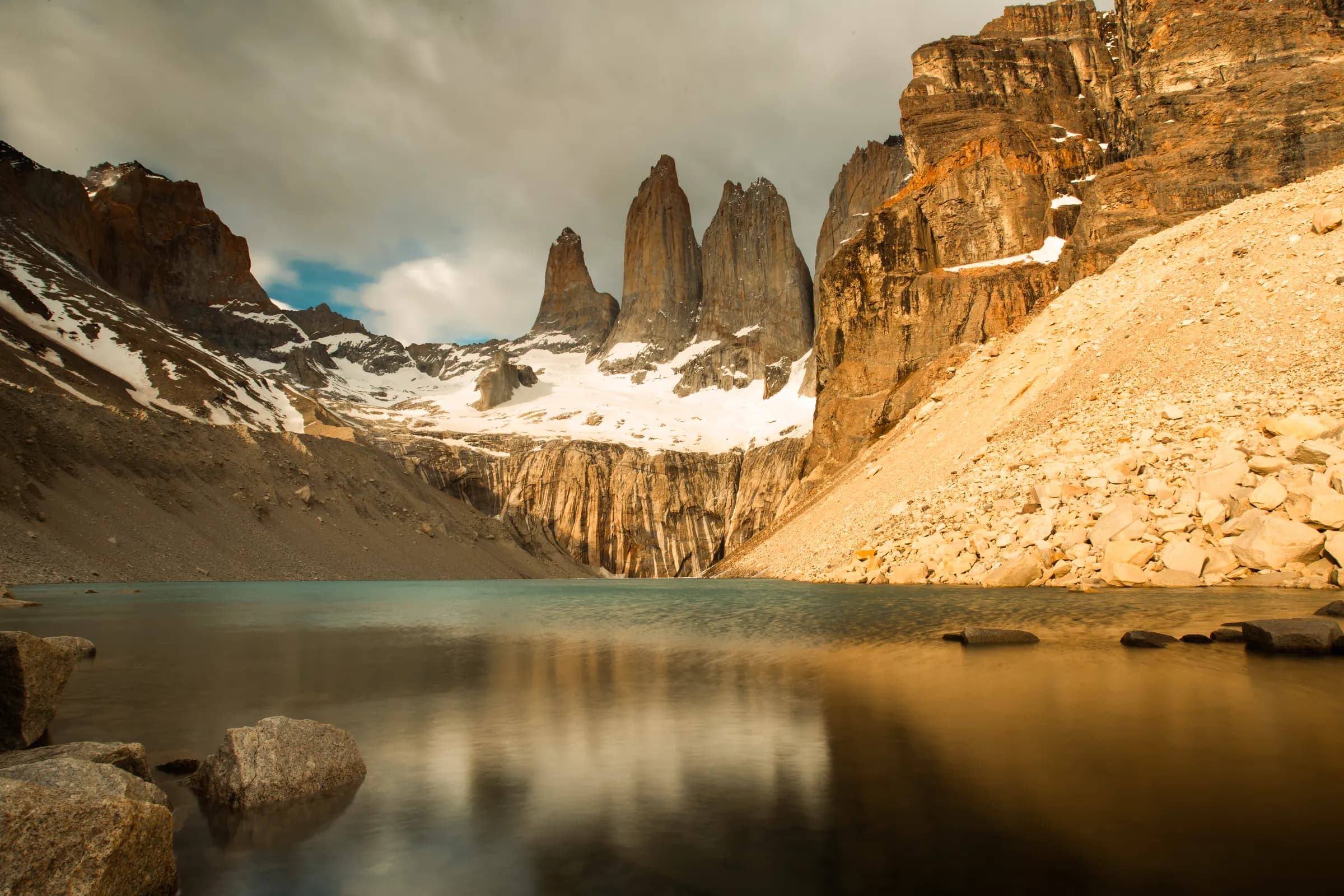 The three granite towers above the glacial lagoon at Mirador Base Torres, Torres del Paine
